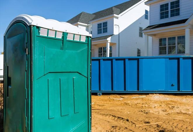 a porta potty lineup at an active construction site